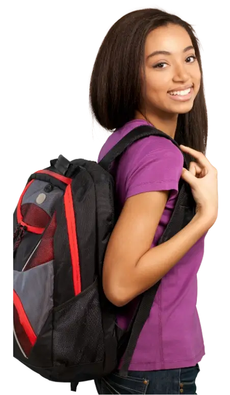 A young female student wearing a purple shirt smiles while carrying a black and red backpack.